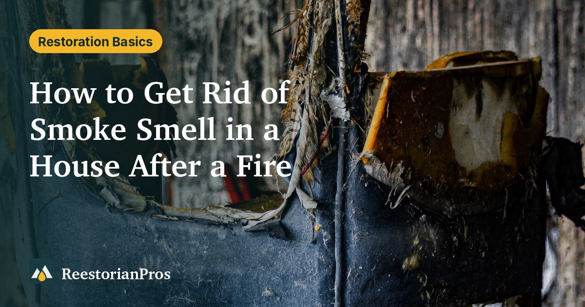 Burned chair in a room with smoke-blackened, peeling walls after a fire